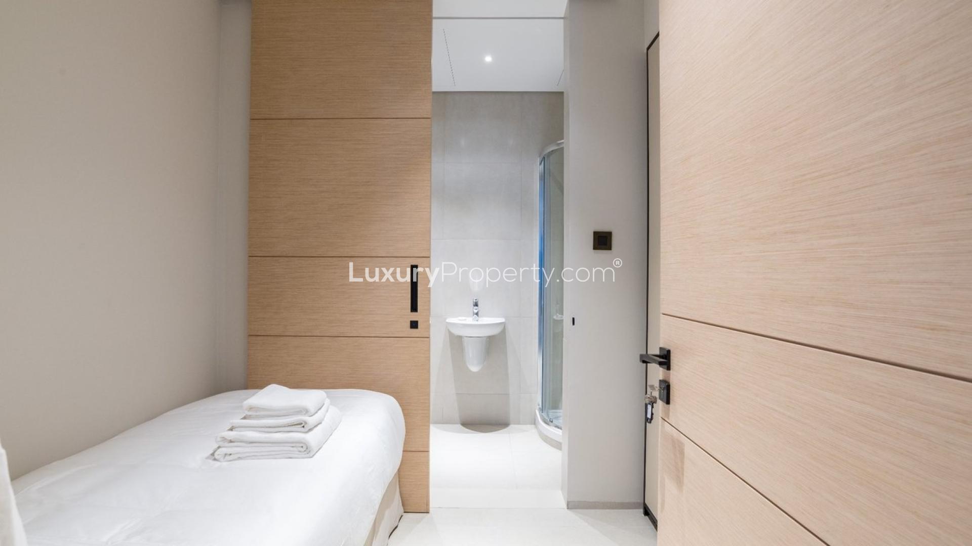 Modern kitchen and living area in Jumeirah Beach Residence apartment for rent