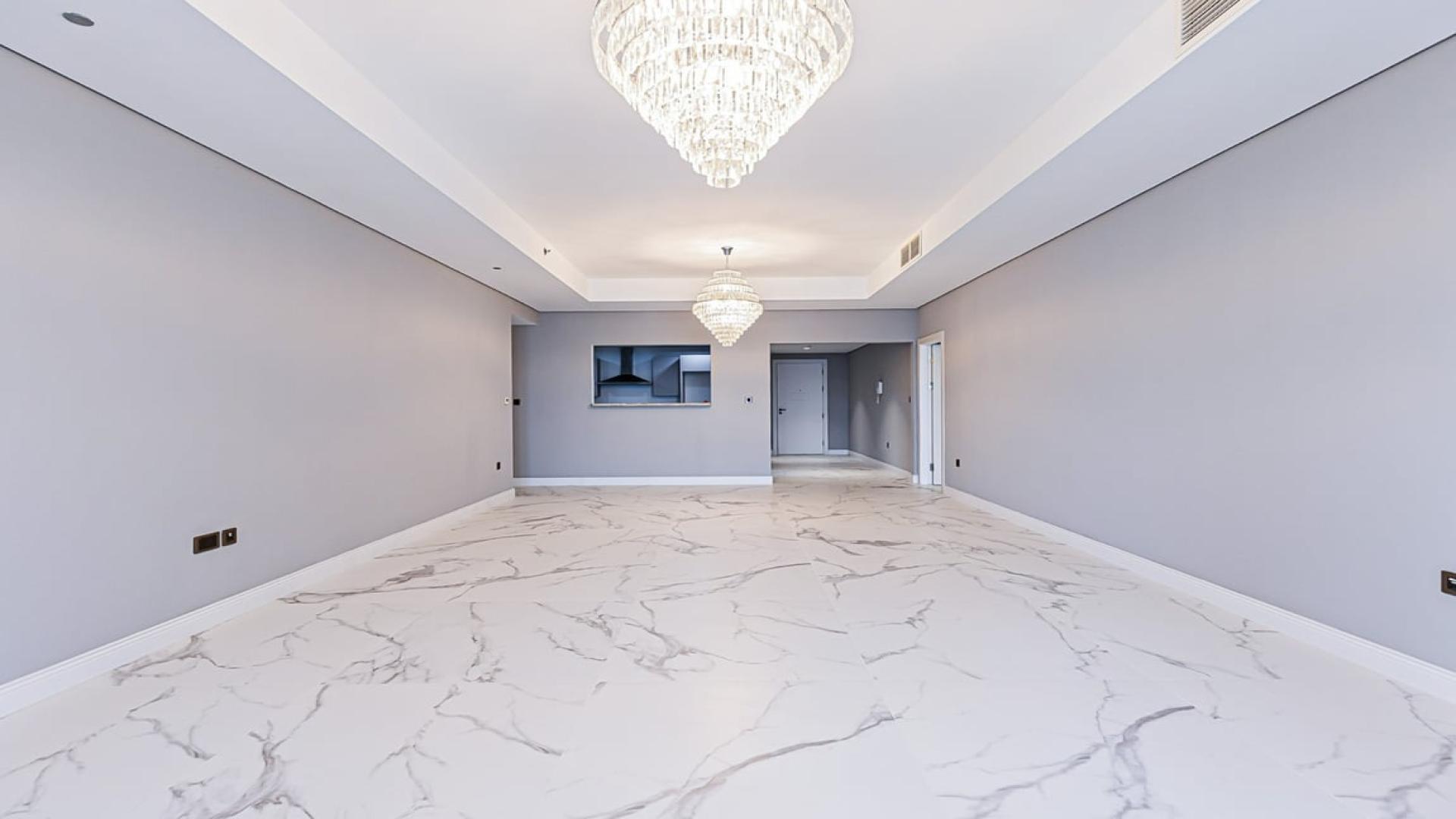 Luxurious apartment interior with chandeliers and marble flooring in Palm Jumeirah, Kingdom of Sheba
