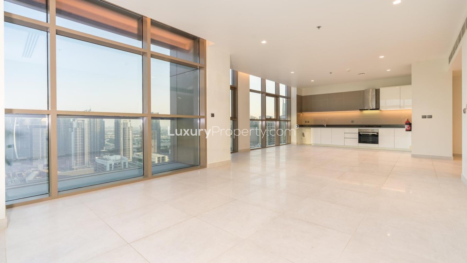 Modern apartment interior with large windows and city view in Dubai Marina, vacant for rent