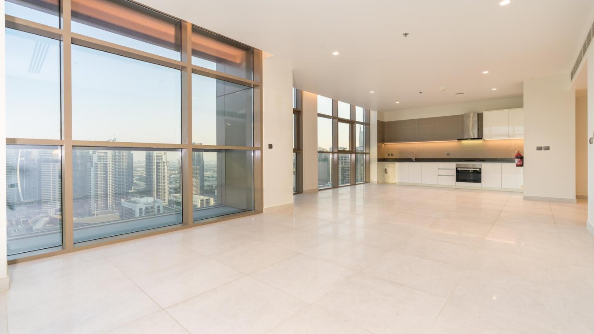 Modern apartment interior with large windows and city view in Dubai Marina, vacant for rent