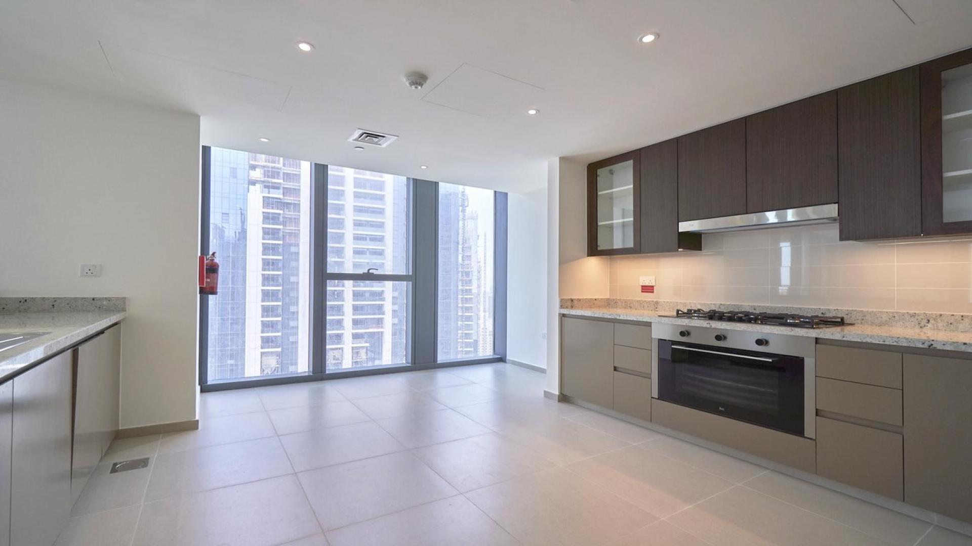 Modern kitchen in 3-bedroom apartment, BLVD Heights, Downtown Dubai, with city views