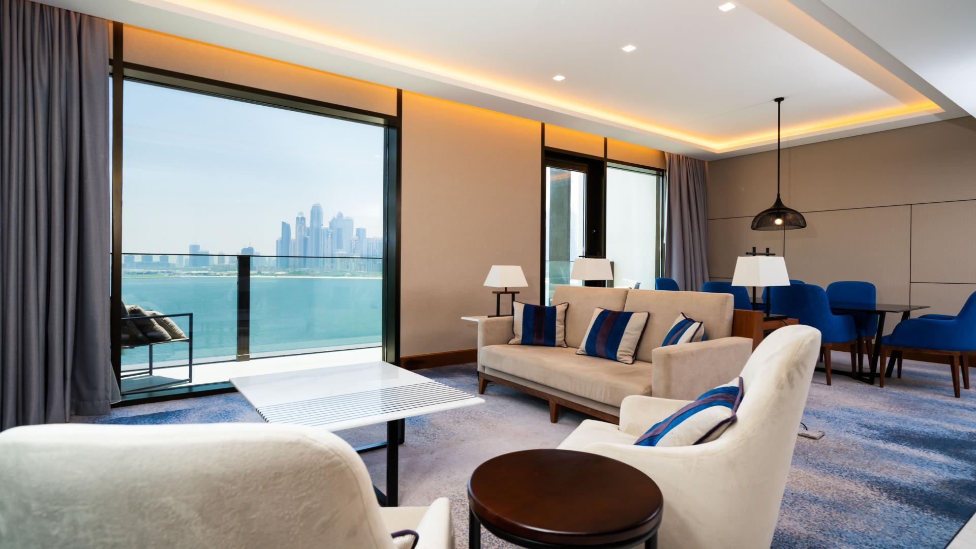 Modern living room in 3-bedroom apartment at Caesars Resort Bluewaters Dubai with sea view