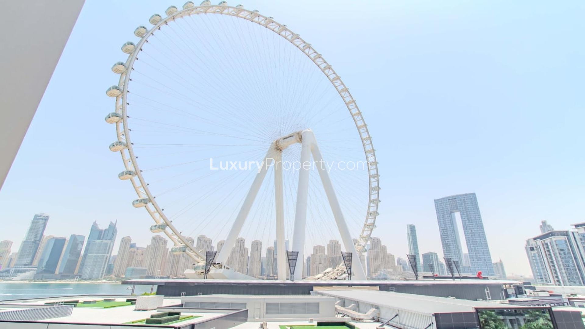 Luxurious Bluewaters apartment living room with Ain Dubai view, modern furnishings, bright ambiance