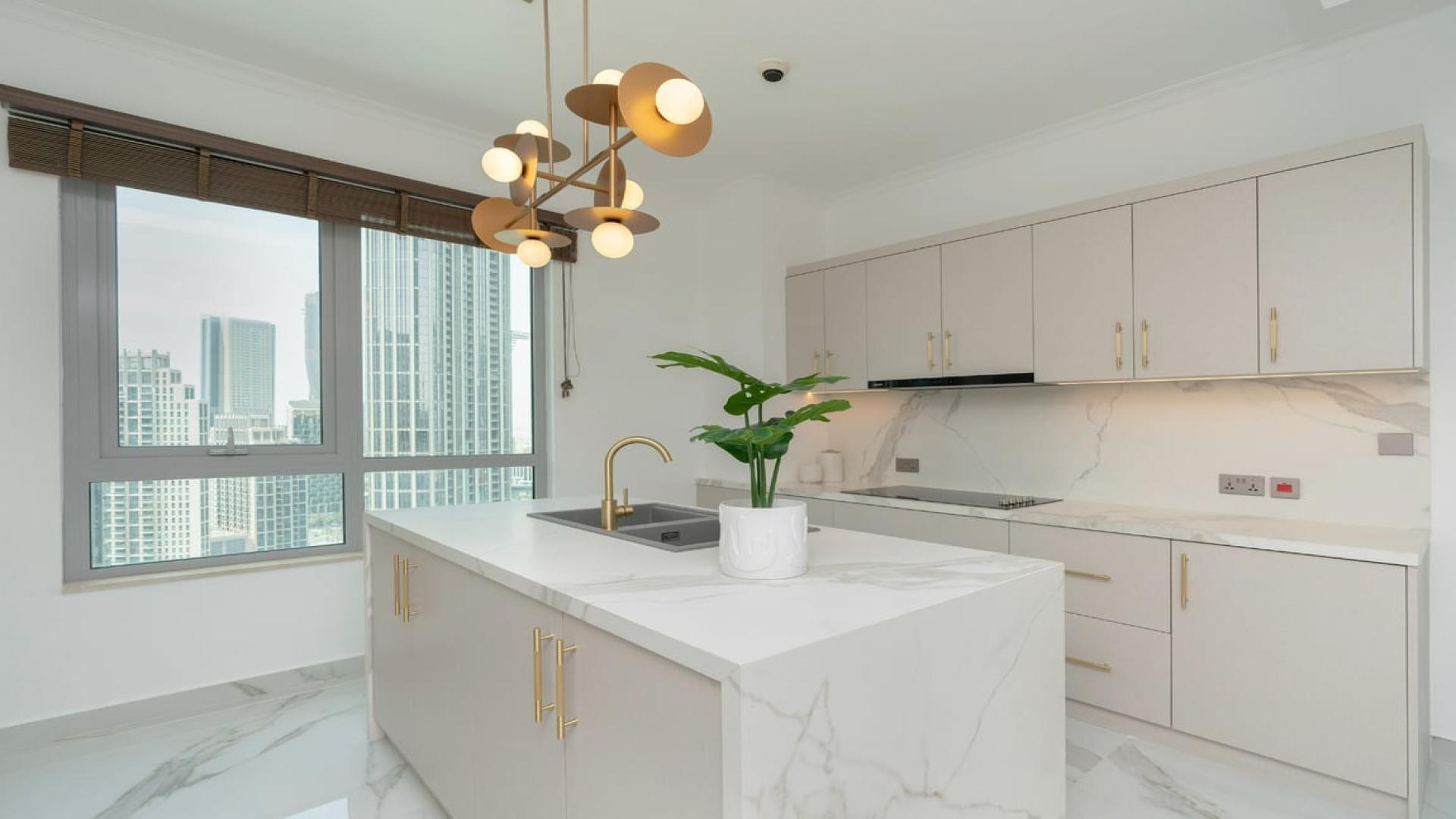 Modern living room and dining area in upgraded Downtown Dubai apartment with Burj Khalifa view