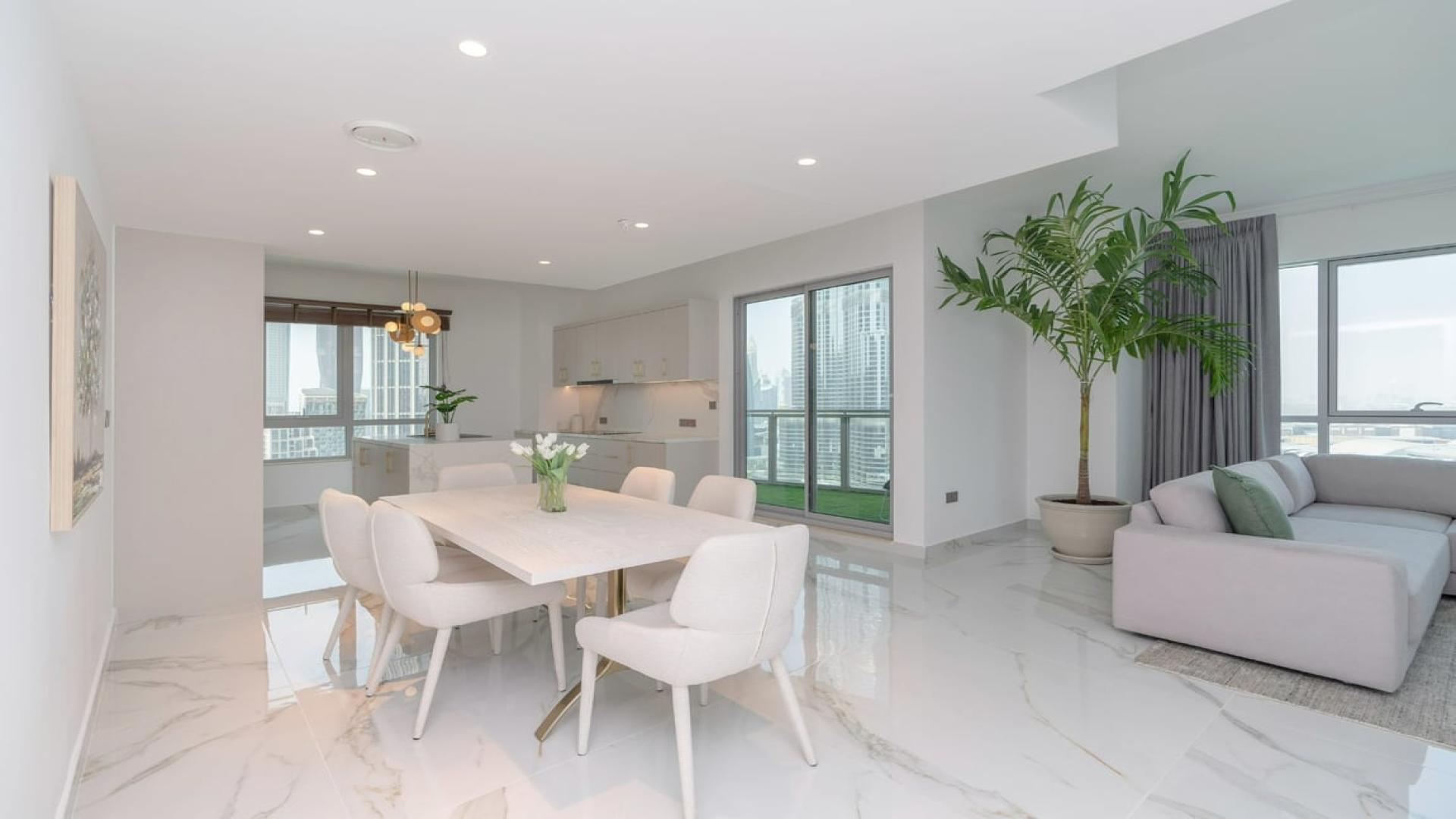 Modern kitchen and dining area in upgraded Downtown Dubai apartment, The Residences, for rent