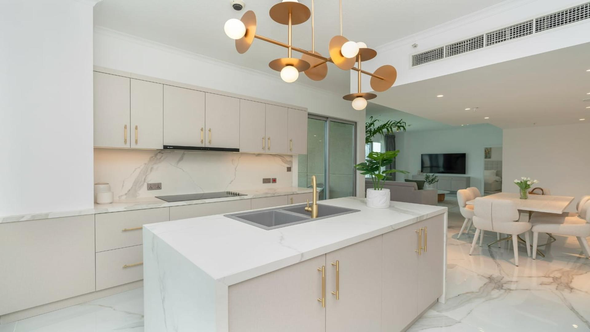 Luxurious Downtown Dubai apartment living room with Burj Khalifa view, modern decor, spacious layout