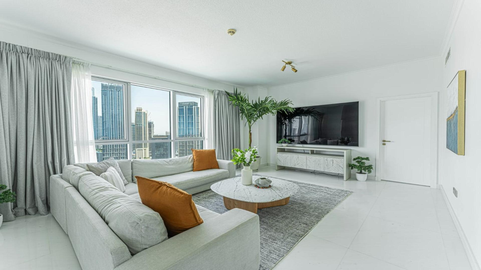 Spacious Downtown Dubai apartment living room with marble flooring and Burj Khalifa view