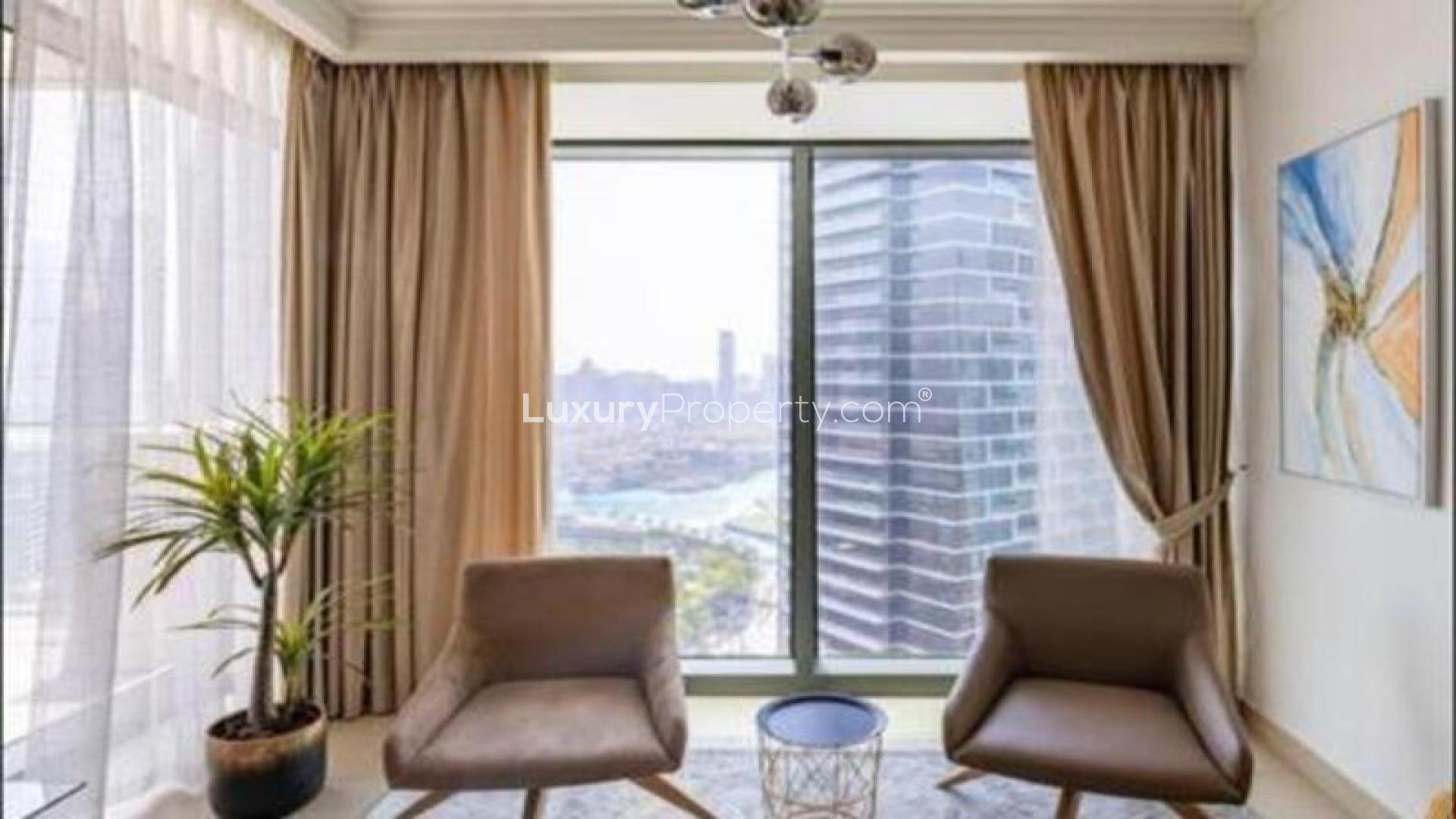 Furnished living and dining area in Burj Vista apartment, Downtown Dubai, with modern decor