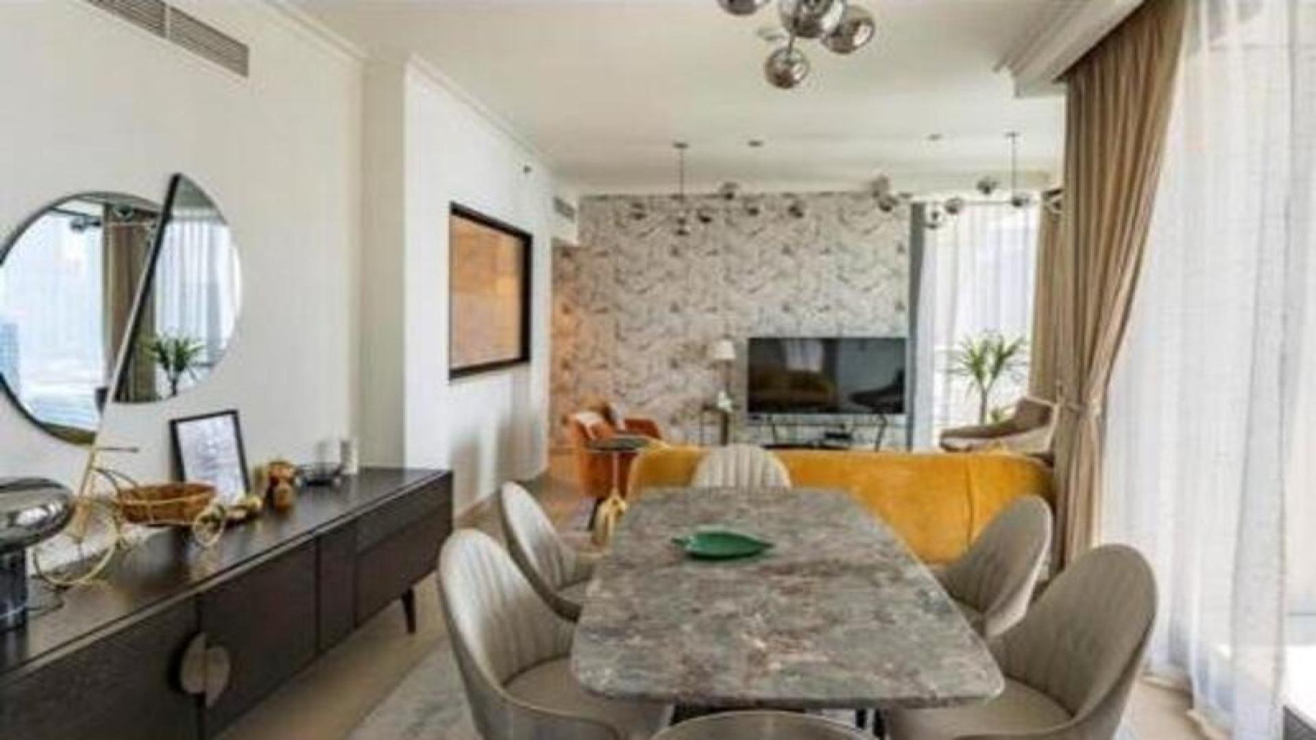 Furnished apartment living room with Burj Khalifa view in Burj Vista, Downtown Dubai