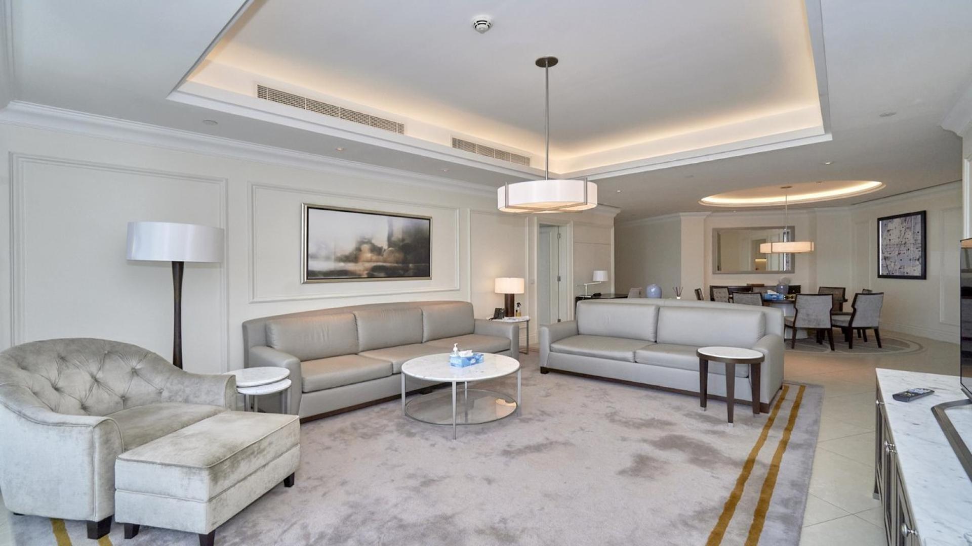 Luxurious living room in 3-bedroom apartment, The Address BLVD, Downtown Dubai, with skyline views