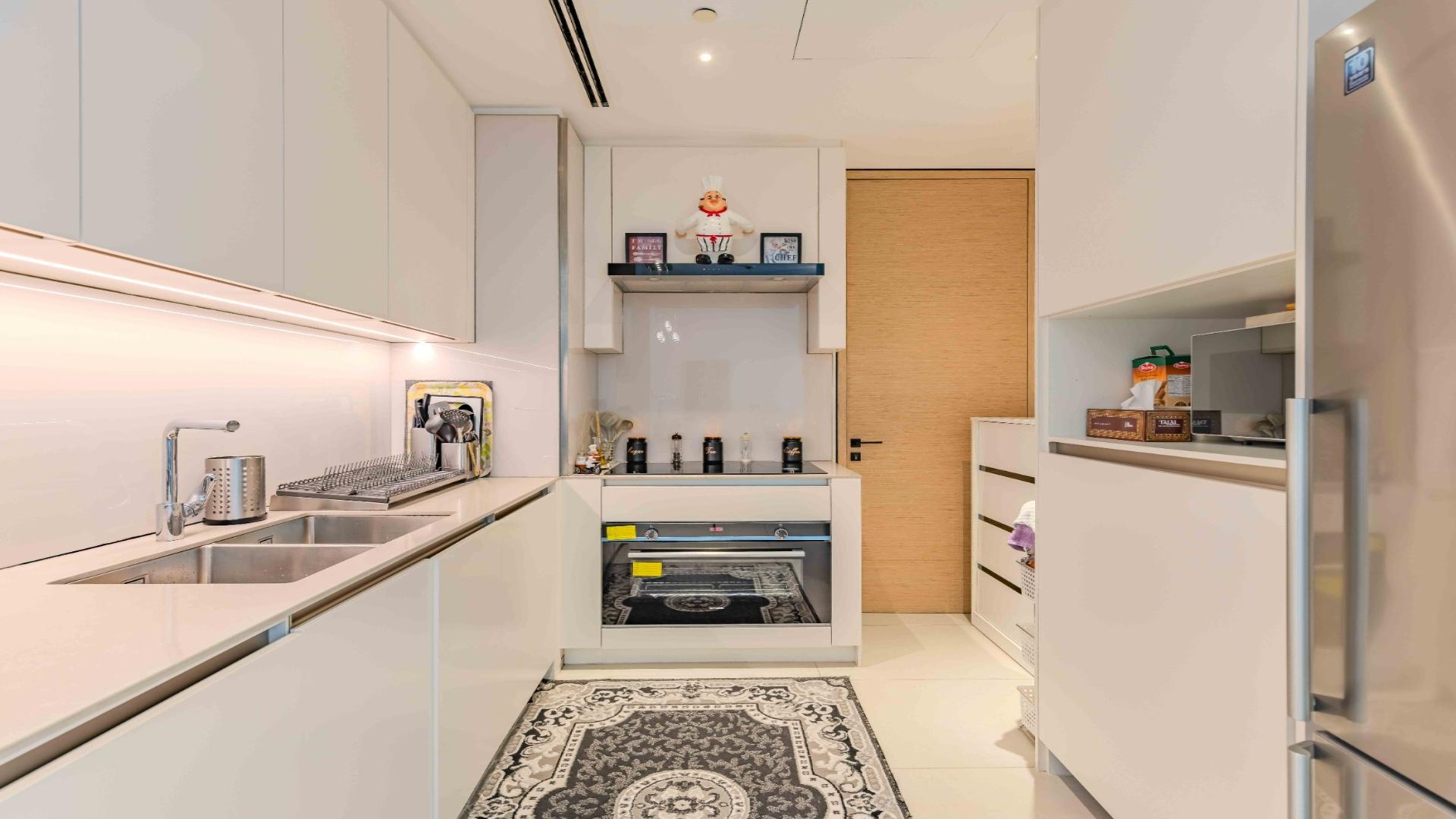 Luxury furnished living room in Jumeirah Beach Residence apartment with elegant decor and sea view