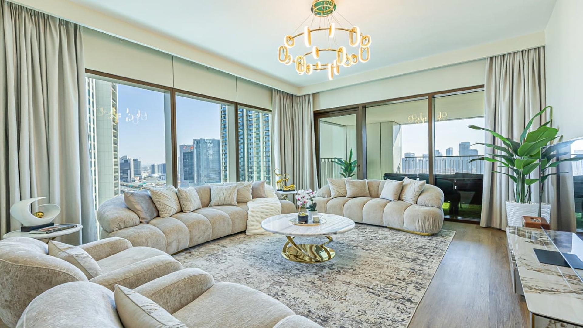 Lavish open-plan living and dining area in Downtown Dubai apartment with Burj Khalifa view