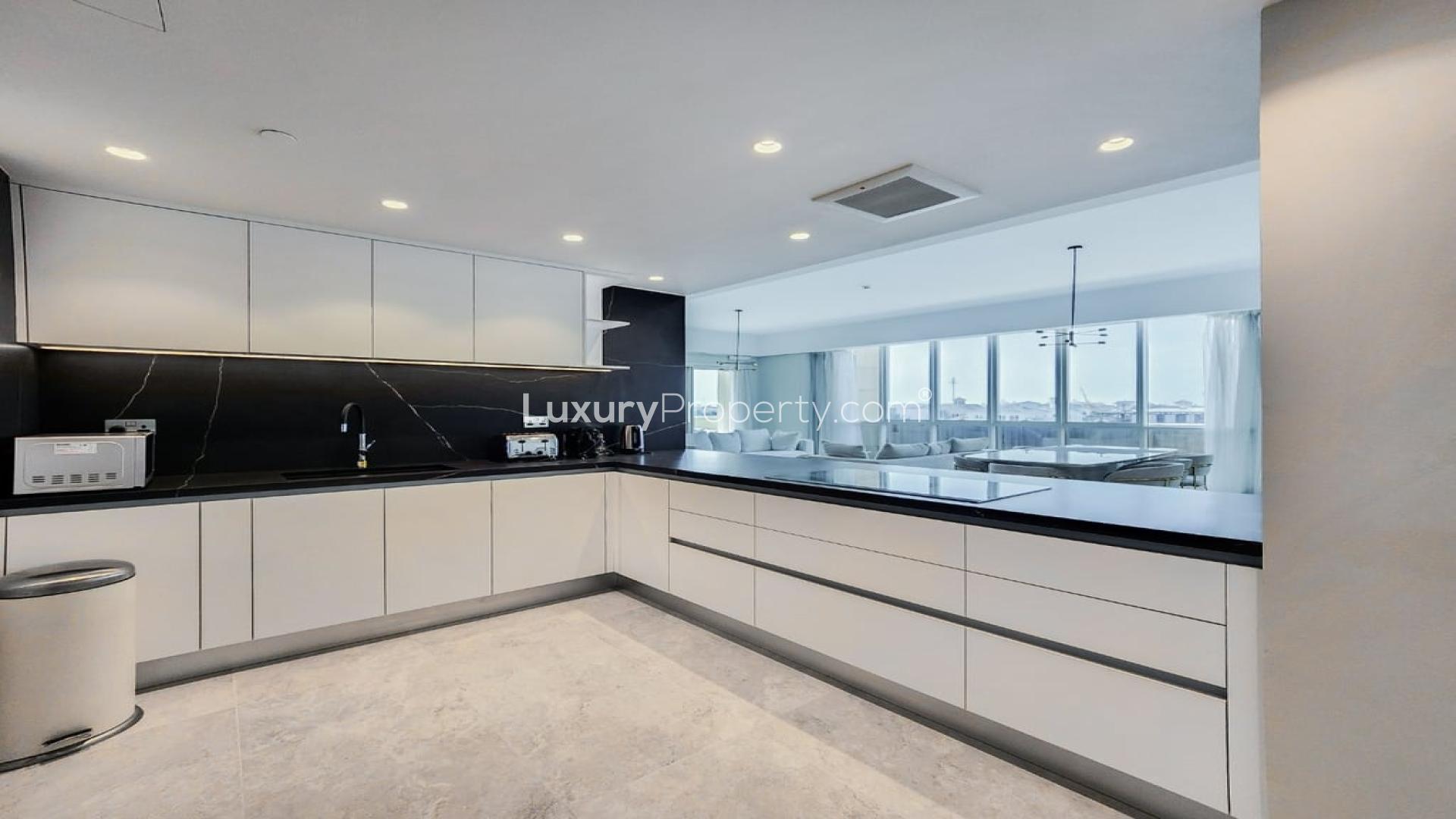 Modern living room in Marina Residences apartment, Palm Jumeirah, with TV and seating area