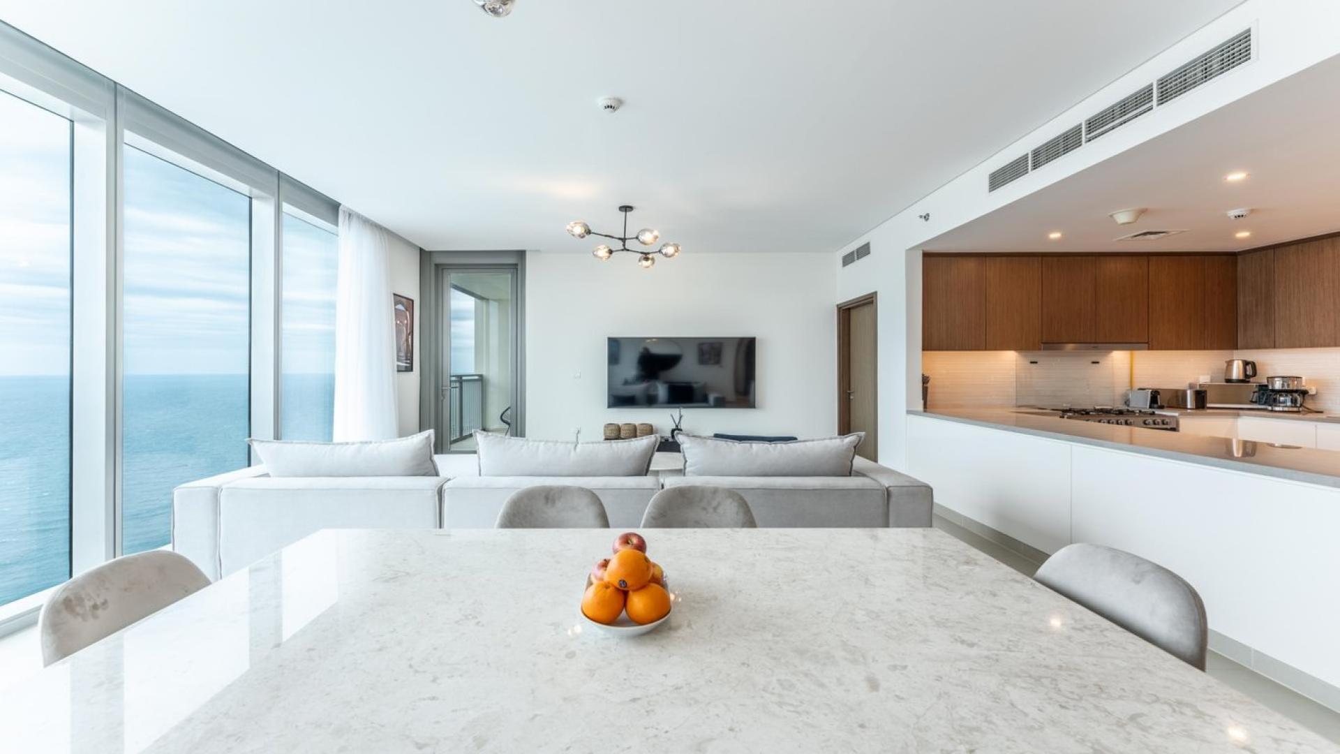 Fully furnished living room with sea view in 3-bedroom Dubai Marina apartment for rent