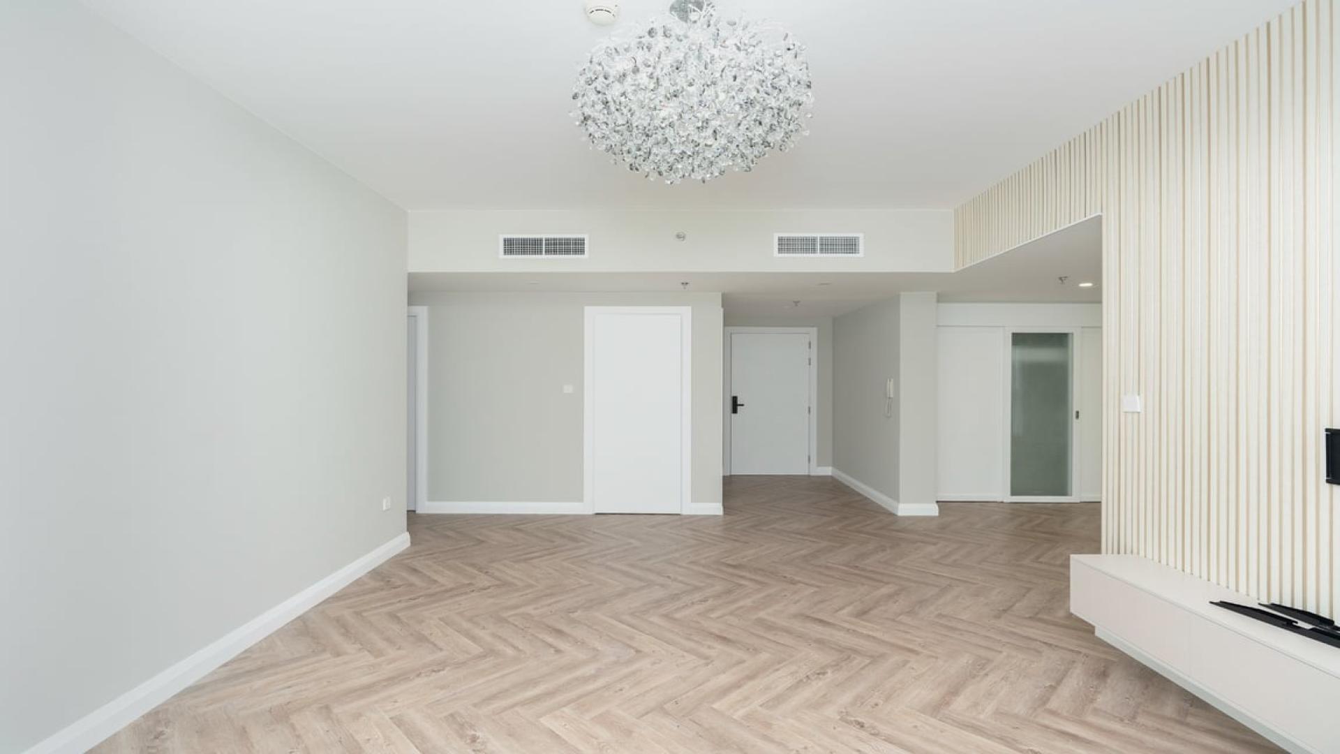 Luxury living room in Al Sahab apartment, Dubai Marina, with modern decor and large window