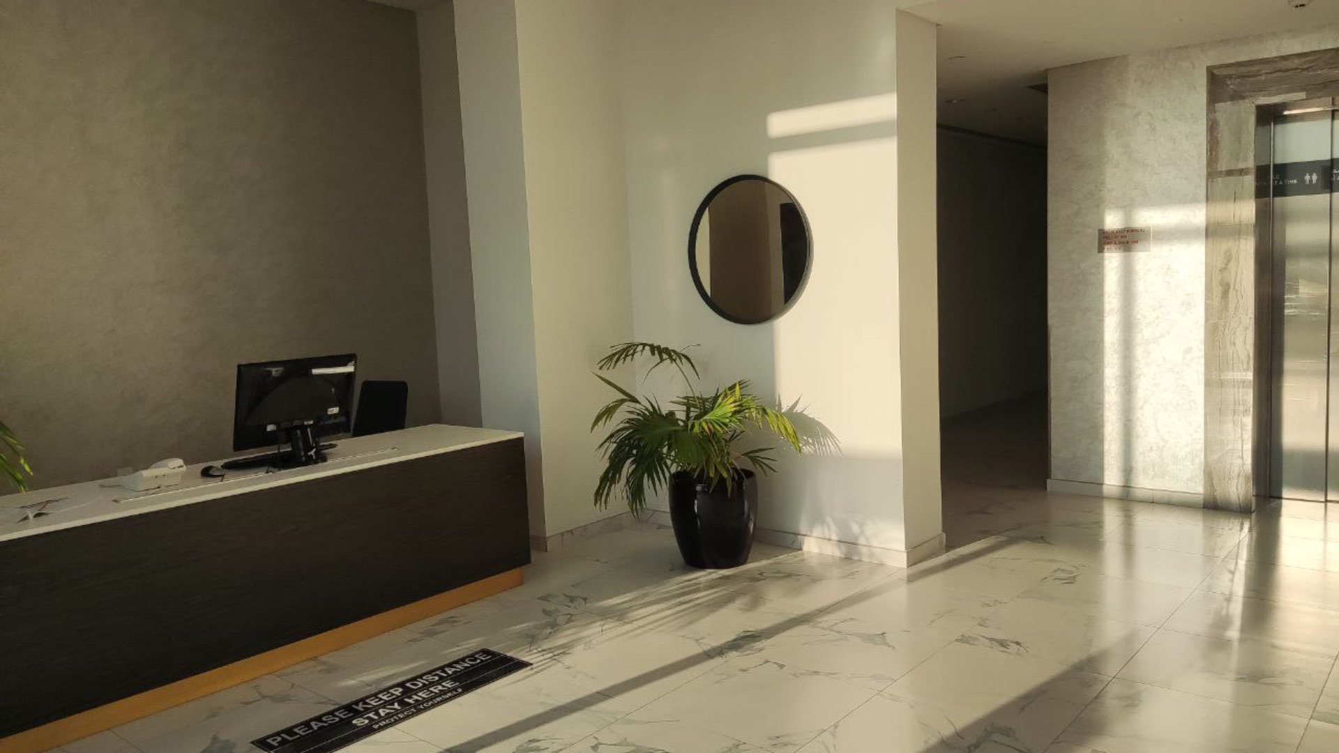 "Modern lobby with reception desk in Al Jaddaf 3-bedroom apartment for sale, LP10662.","Modern elevator in spacious 3-bedroom apartment for sale, Al Jaddaf, LP10662.",Bedroom with large window in spacious Al Jaddaf apartment for sale