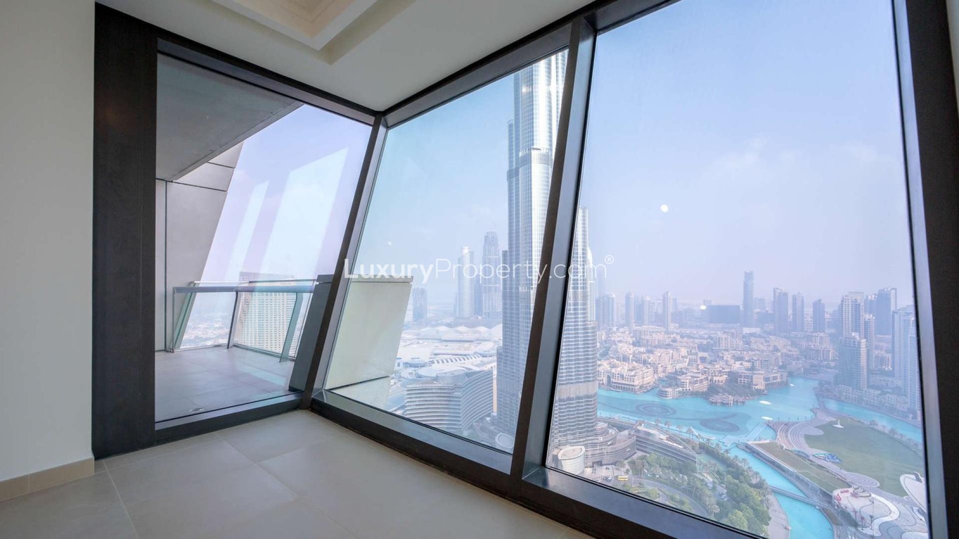 Empty room with large windows offering Burj Khalifa view, Burj Vista apartment, Downtown Dubai