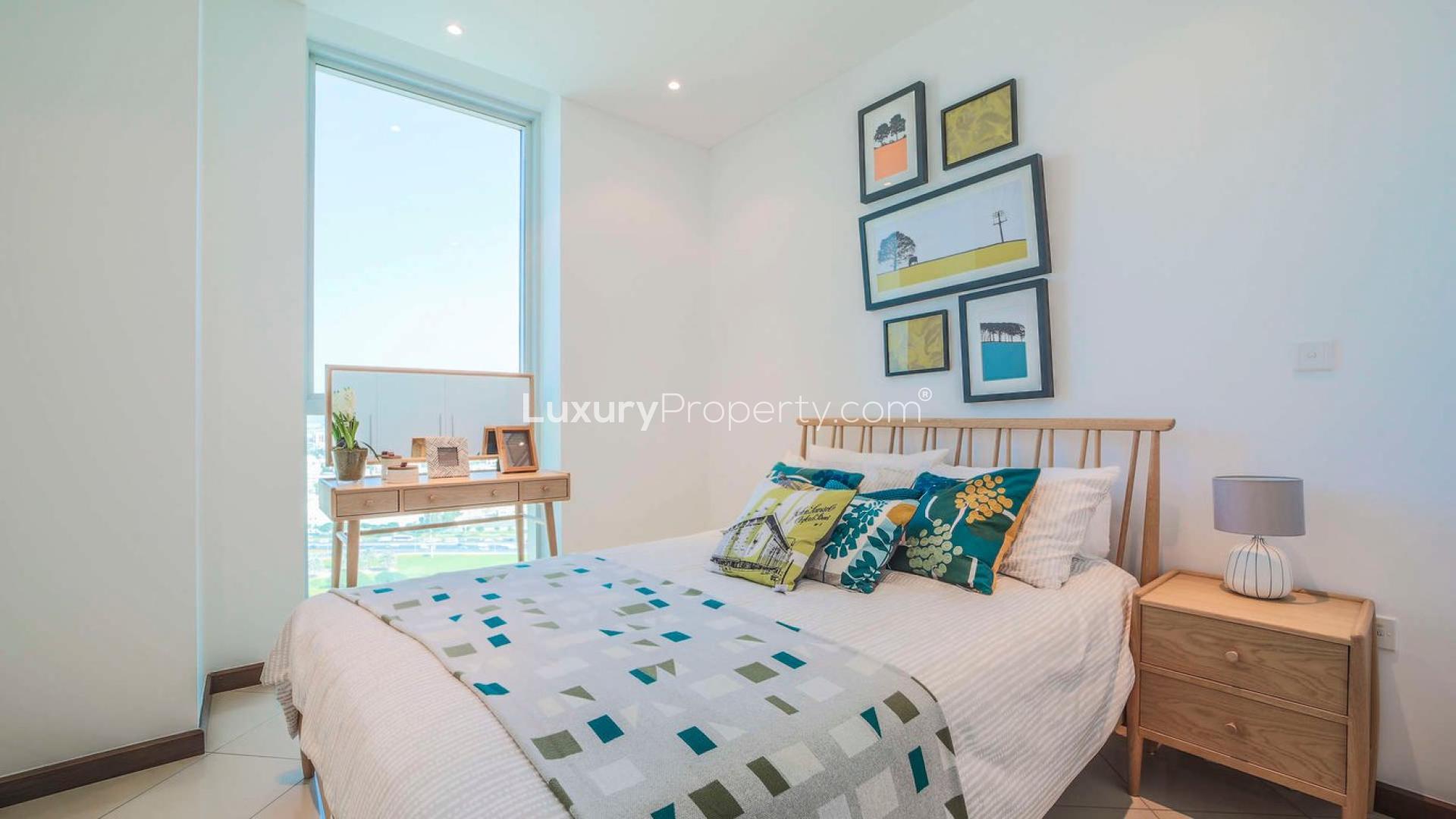 "Spacious living and dining area in Marsa Plaza three-bedroom apartment, Dubai Festival City.",Bright bedroom in three-bedroom apartment at Marsa Plaza, Dubai Festival City, for sale