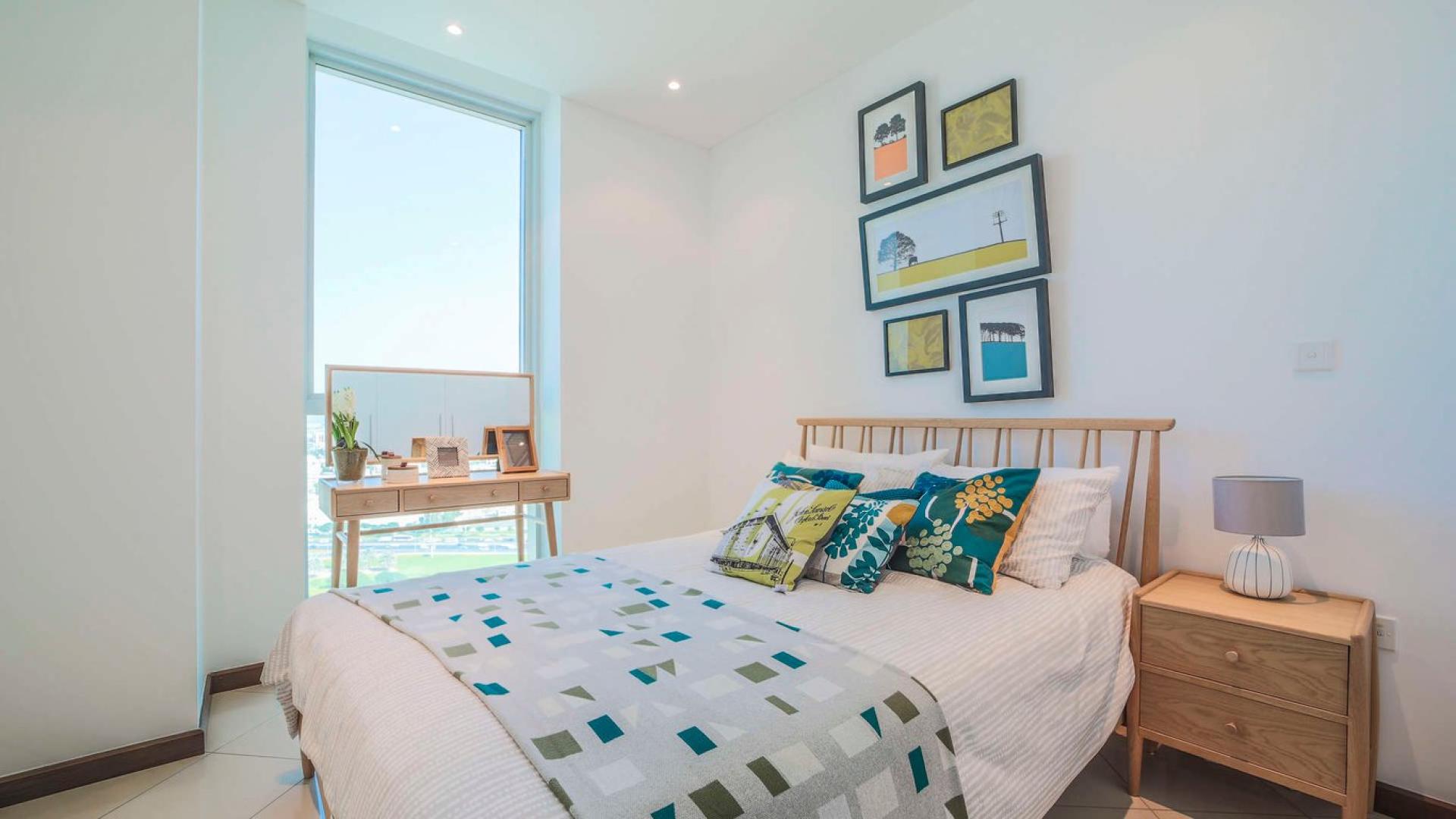 "Spacious living and dining area in Marsa Plaza three-bedroom apartment, Dubai Festival City.",Bright bedroom in three-bedroom apartment at Marsa Plaza, Dubai Festival City, for sale