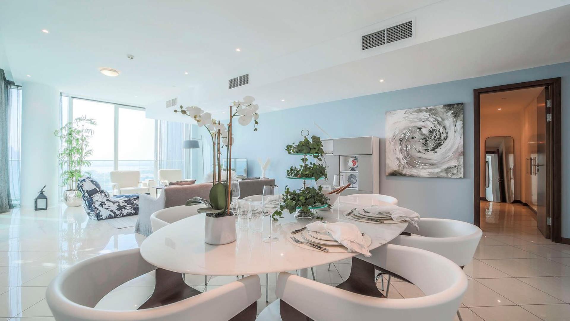 Modern living and dining area in Marsa Plaza apartment, Dubai Festival City, for sale