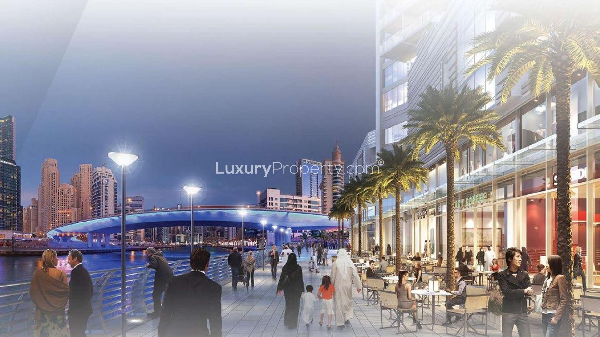 "Stunning Dubai Marina skyline view from beachfront apartment for sale in 5242 community.",Dubai Marina waterfront promenade near 5242 Apartments, vibrant evening with people and cityscape