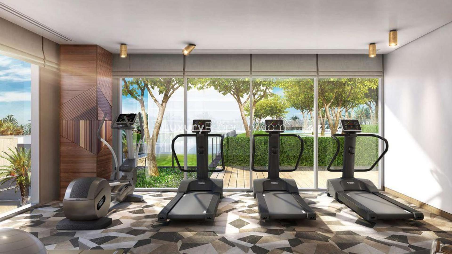 Elegant dining area with panoramic golf course view at Dubai Hills Estate apartment