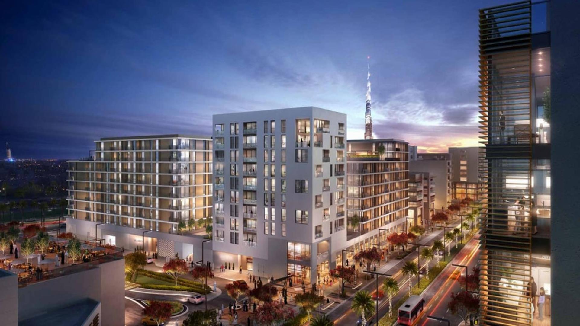 Modern open-plan living area in Park Point apartment, Dubai Hills Estate, with stylish decor