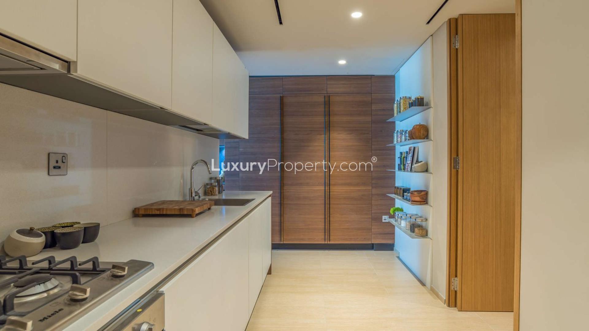 Luxurious open-plan kitchen and living area in One Palm Jumeirah apartment for sale