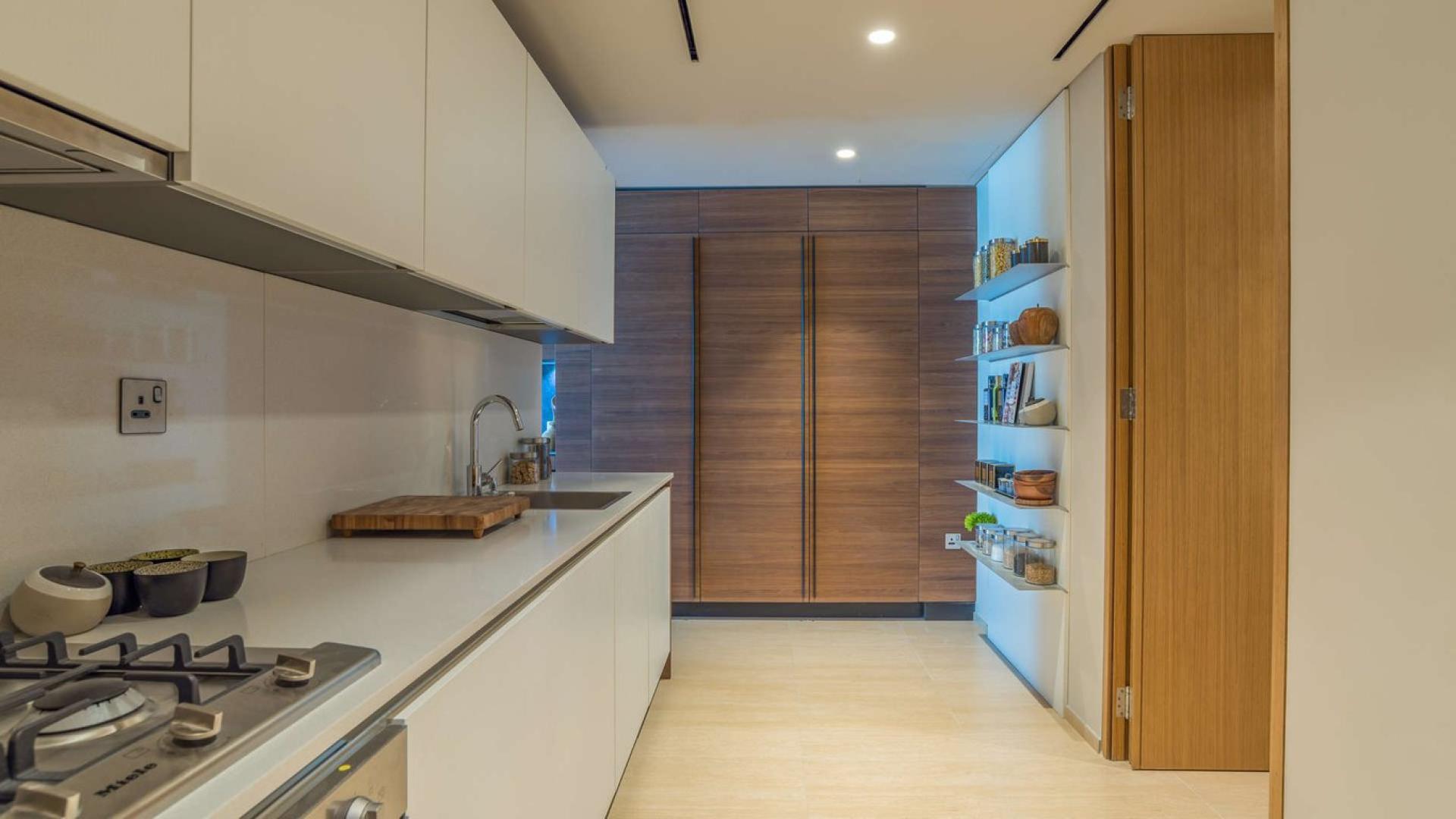 Luxurious open-plan kitchen and living area in One Palm Jumeirah apartment for sale