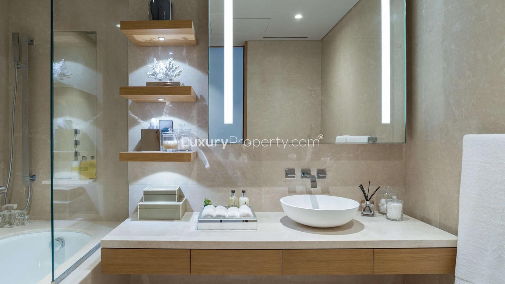 Luxurious open-plan living area in One Palm apartment, Palm Jumeirah, with modern interiors