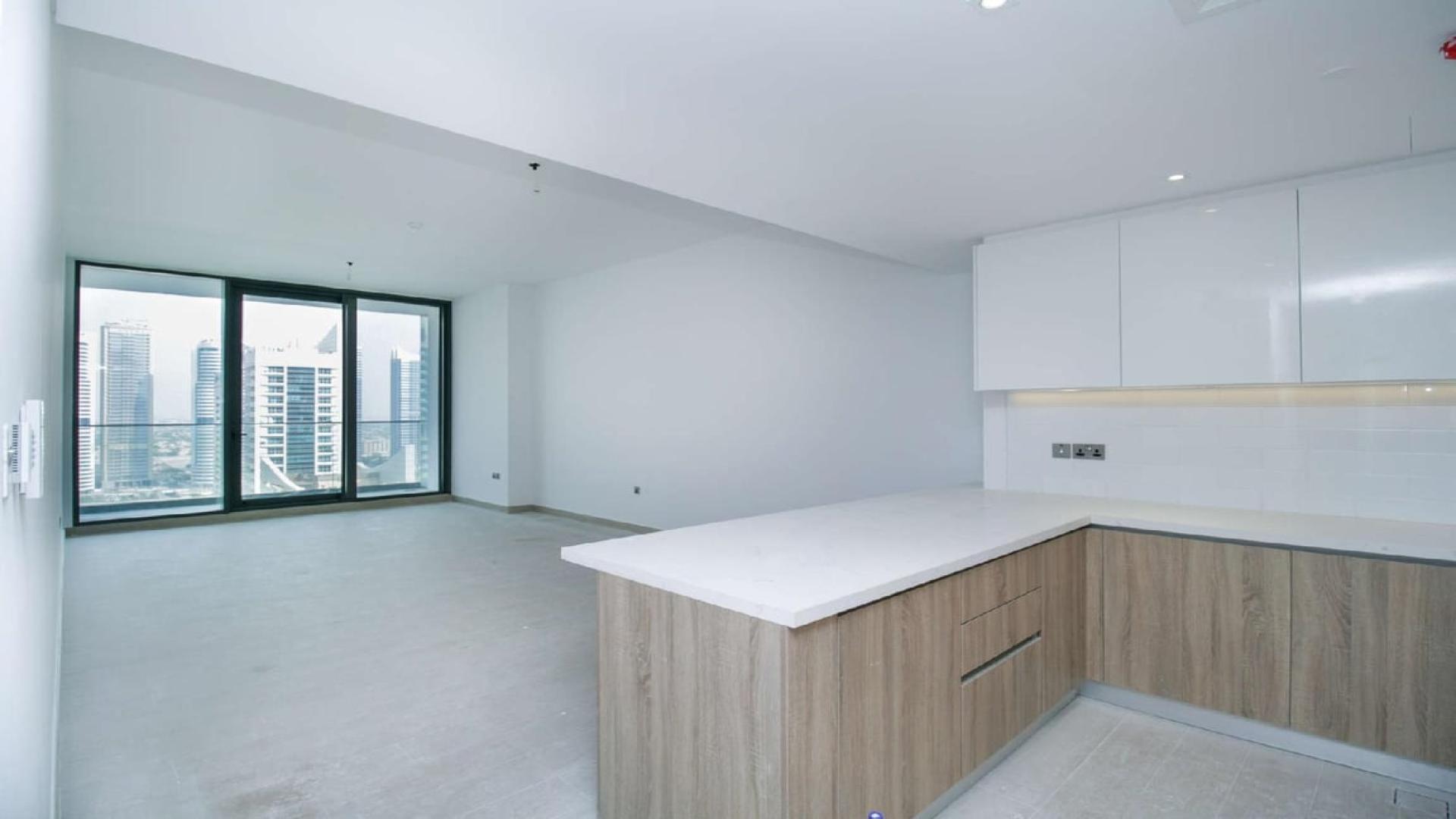Modern kitchen and living area in three-bedroom apartment, LIV Residence, Dubai Marina