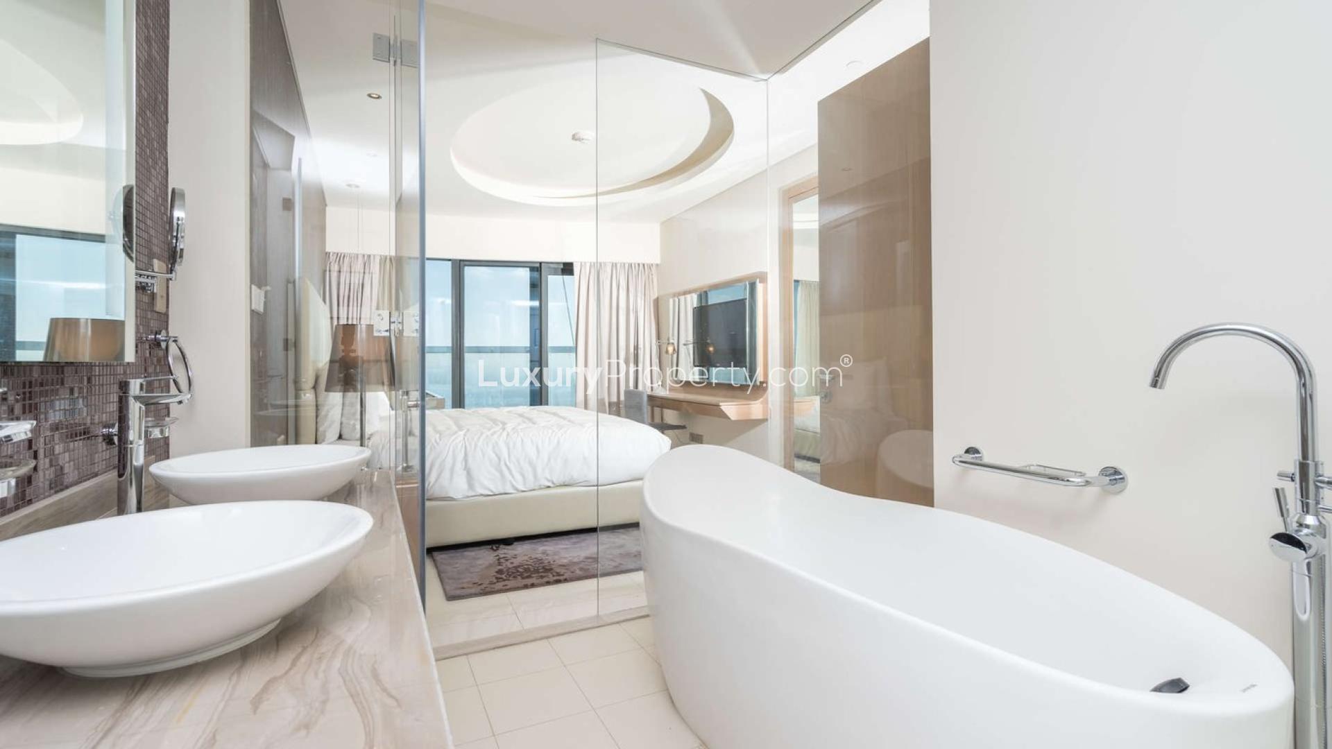 Modern living and dining area in three-bedroom apartment, Paramount Hotel, Business Bay