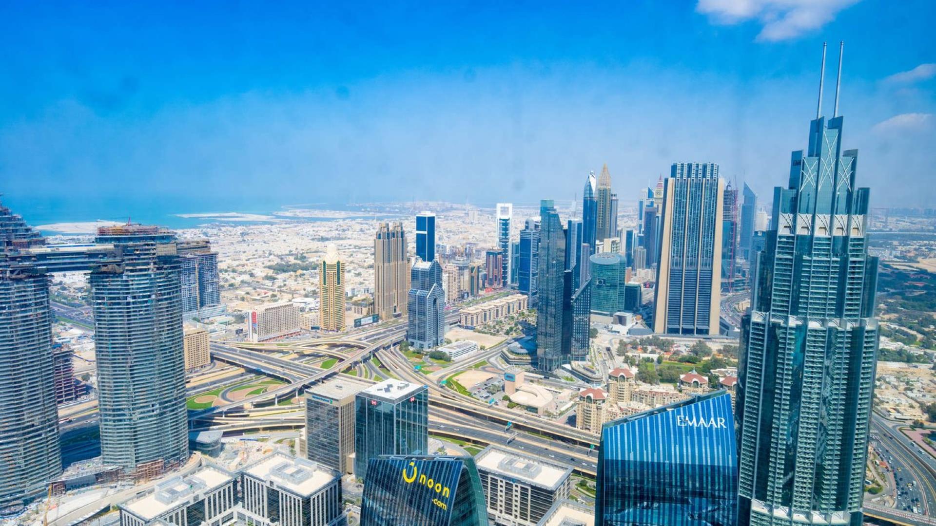 Luxurious living room in 3-bedroom Burj Khalifa apartment, Downtown Dubai, elegant furnishings