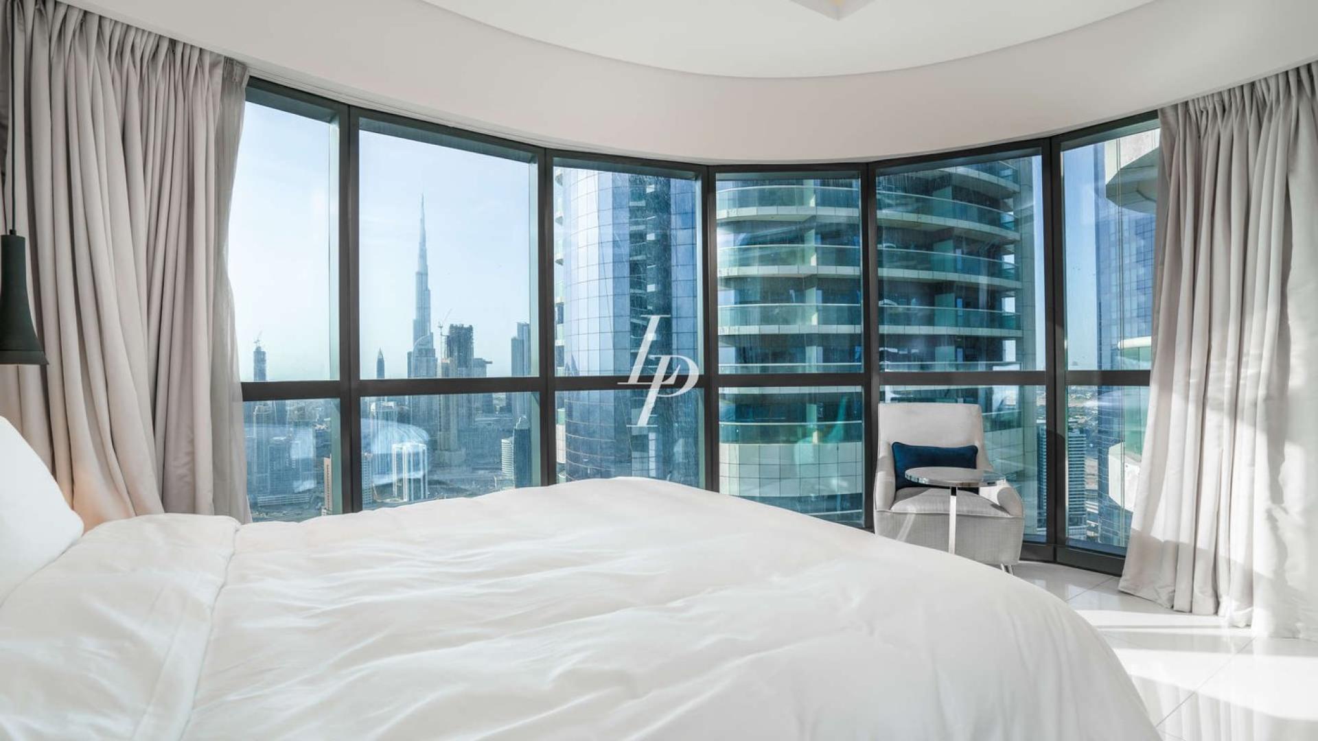 Luxury bedroom with panoramic sea views in Business Bay apartment, Dubai