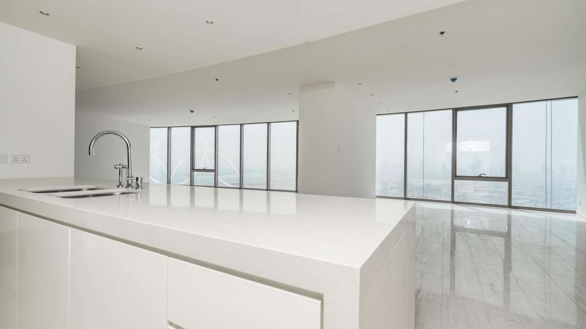 Spacious living room with large windows in D1 Tower apartment, Culture Village, Dubai