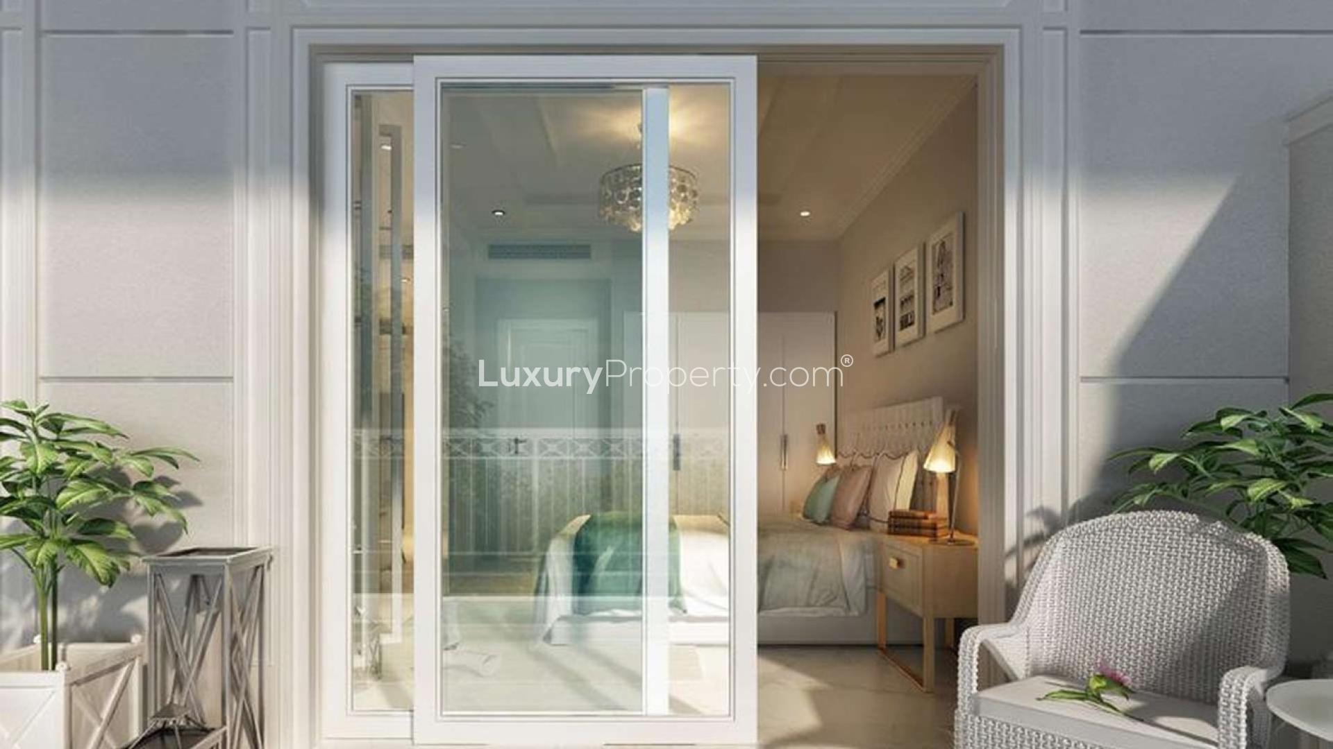 Stylish studio apartment interior at Vincitore Benessere, Dubailand, featuring modern decor and balcony