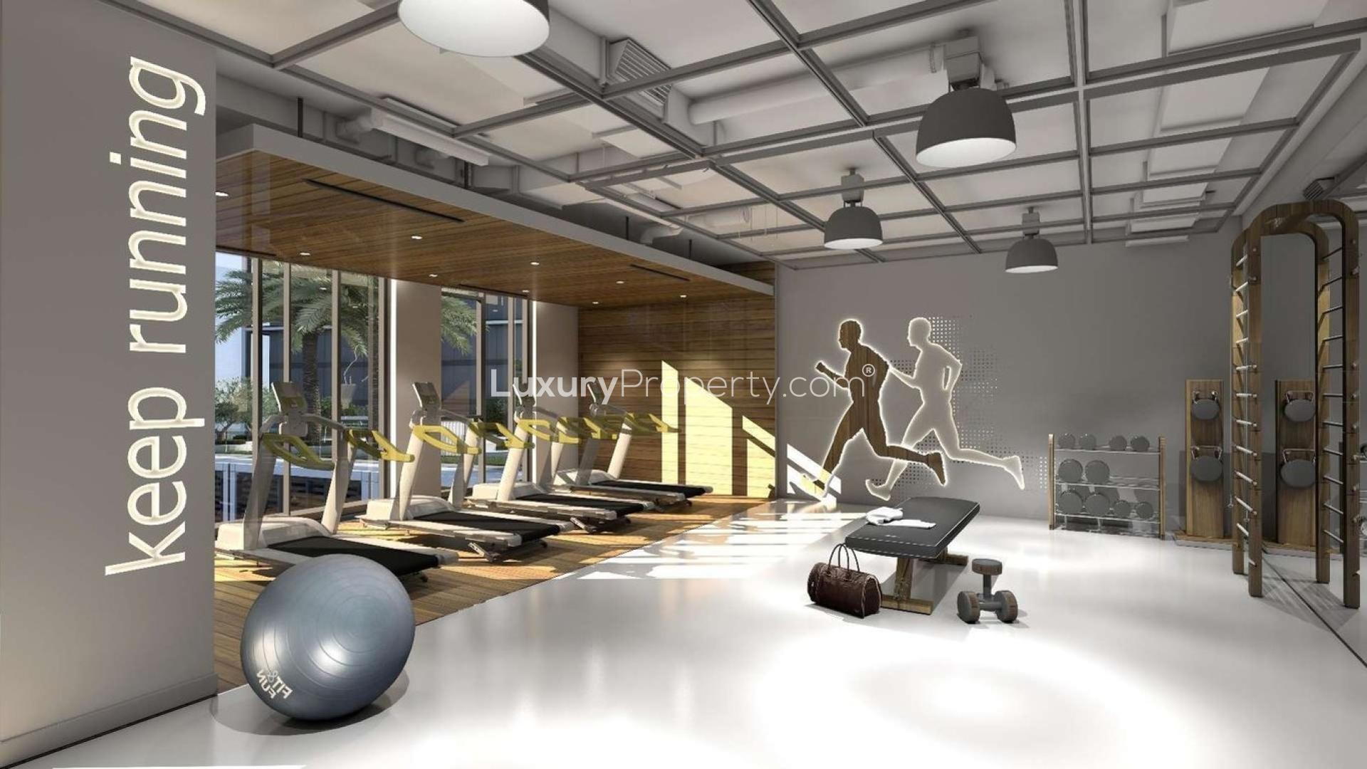"Modern Dubai Creek Harbour apartment with stunning waterfront view, Creek Edge community, for sale.",Modern gym with treadmills and equipment in Creek Edge, Dubai Creek Harbour apartment for sale