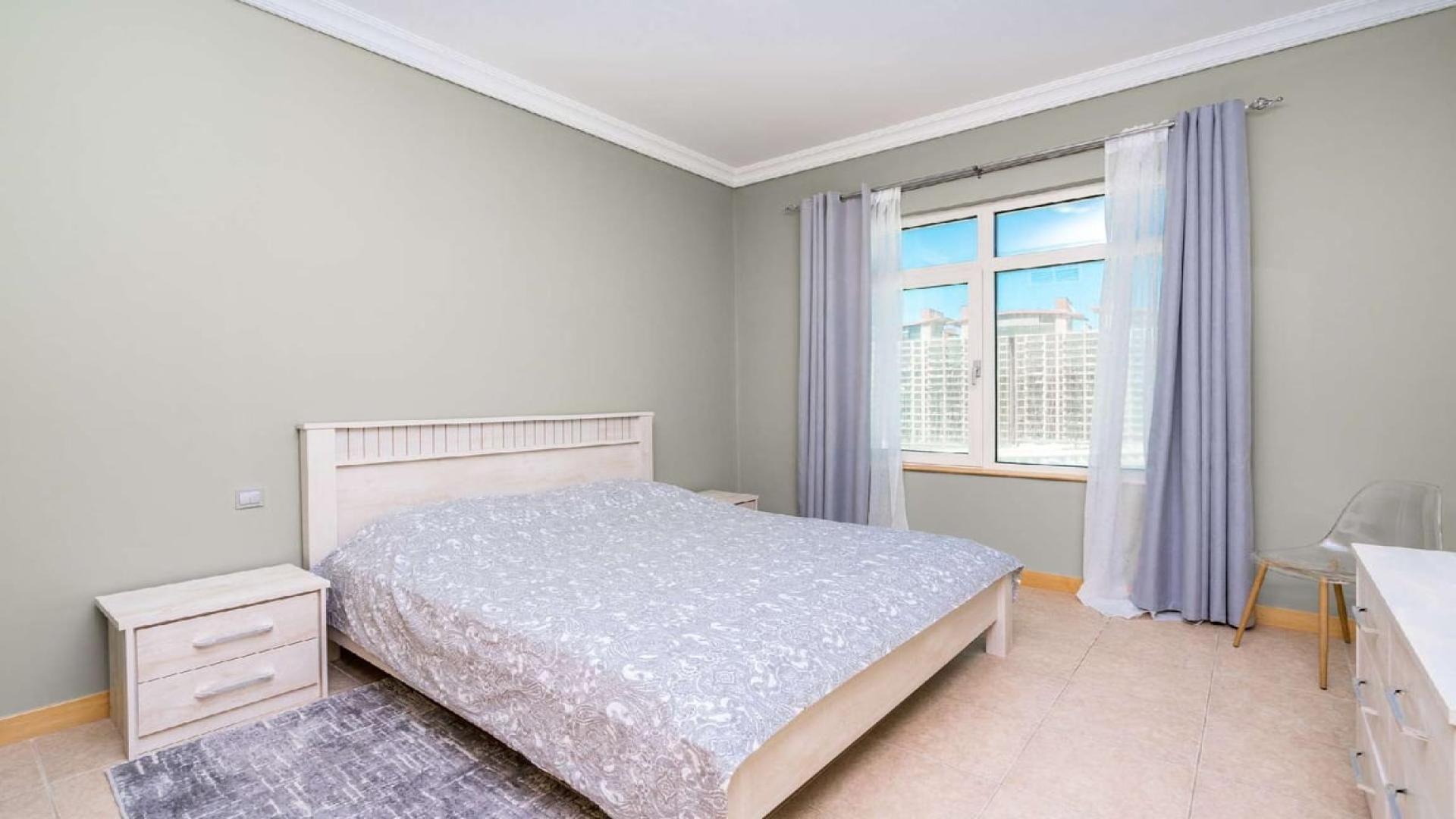 Contemporary living room in Al Nabat Shoreline Apartments, Palm Jumeirah, with elegant decor and seating