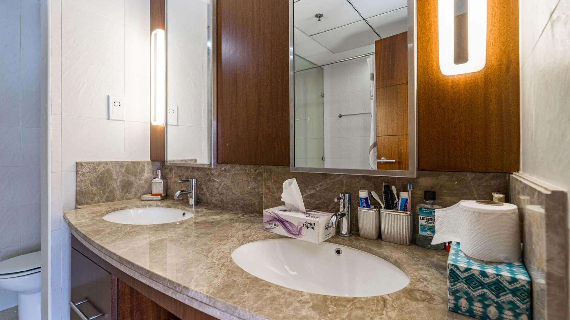 Living room in 3-bedroom apartment, Standpoint Towers, Downtown Dubai, with elegant decor and lighting