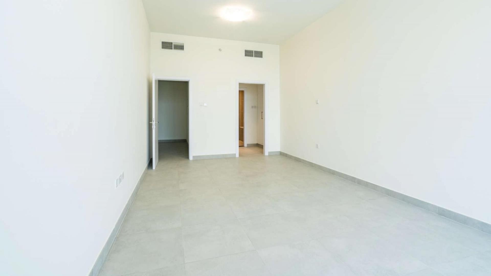 Spacious duplex living room with large windows and stunning Dubai Marina views in Marina Arcade