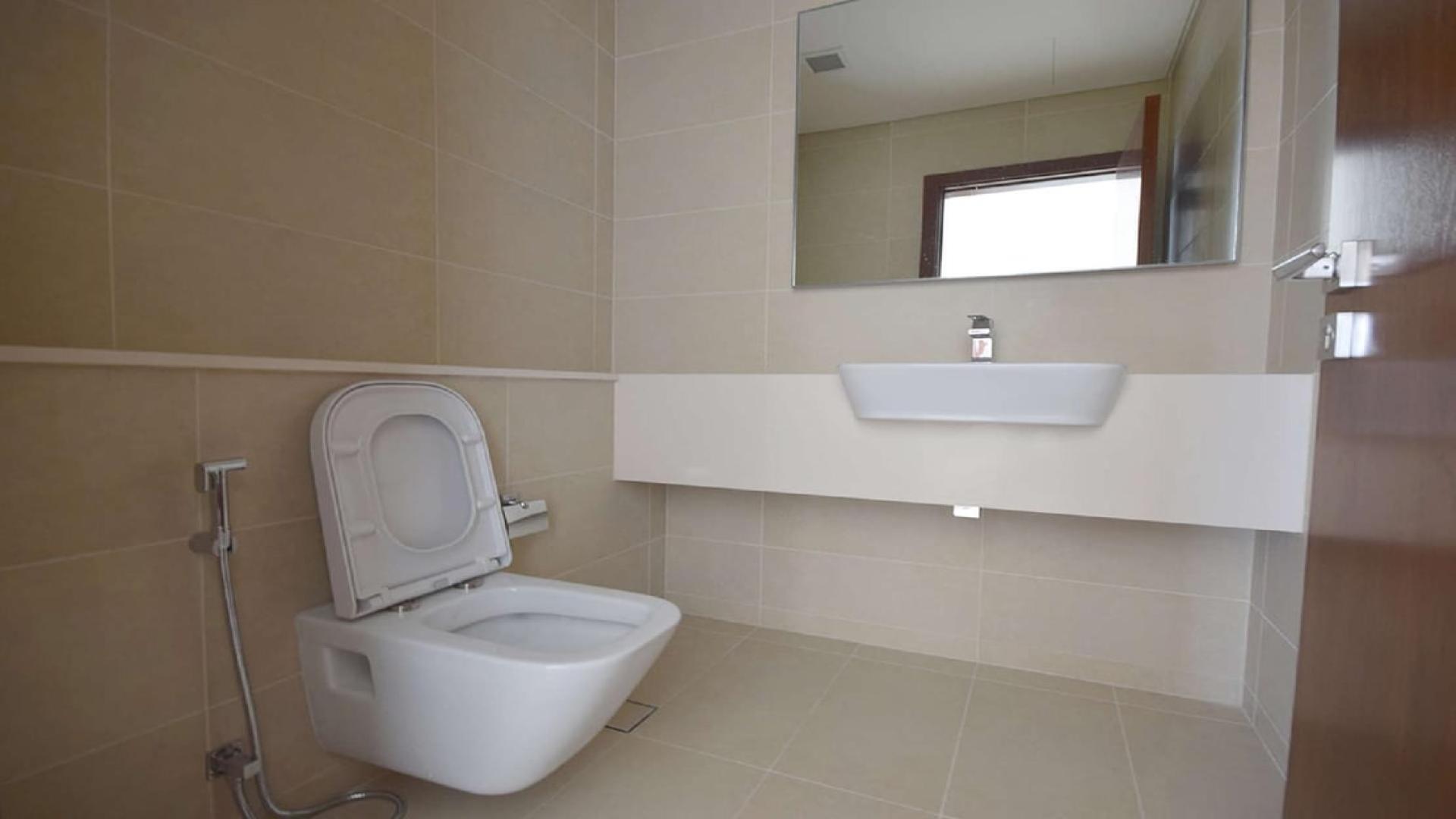 Modern open-plan kitchen in waterfront apartment, Marina Gate, Dubai Marina, for sale