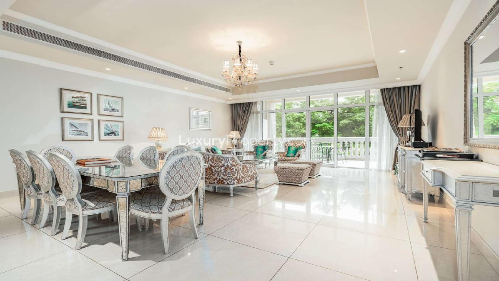 Elegant living room in spacious Kempinski Palm Jumeirah apartment with garden view balcony