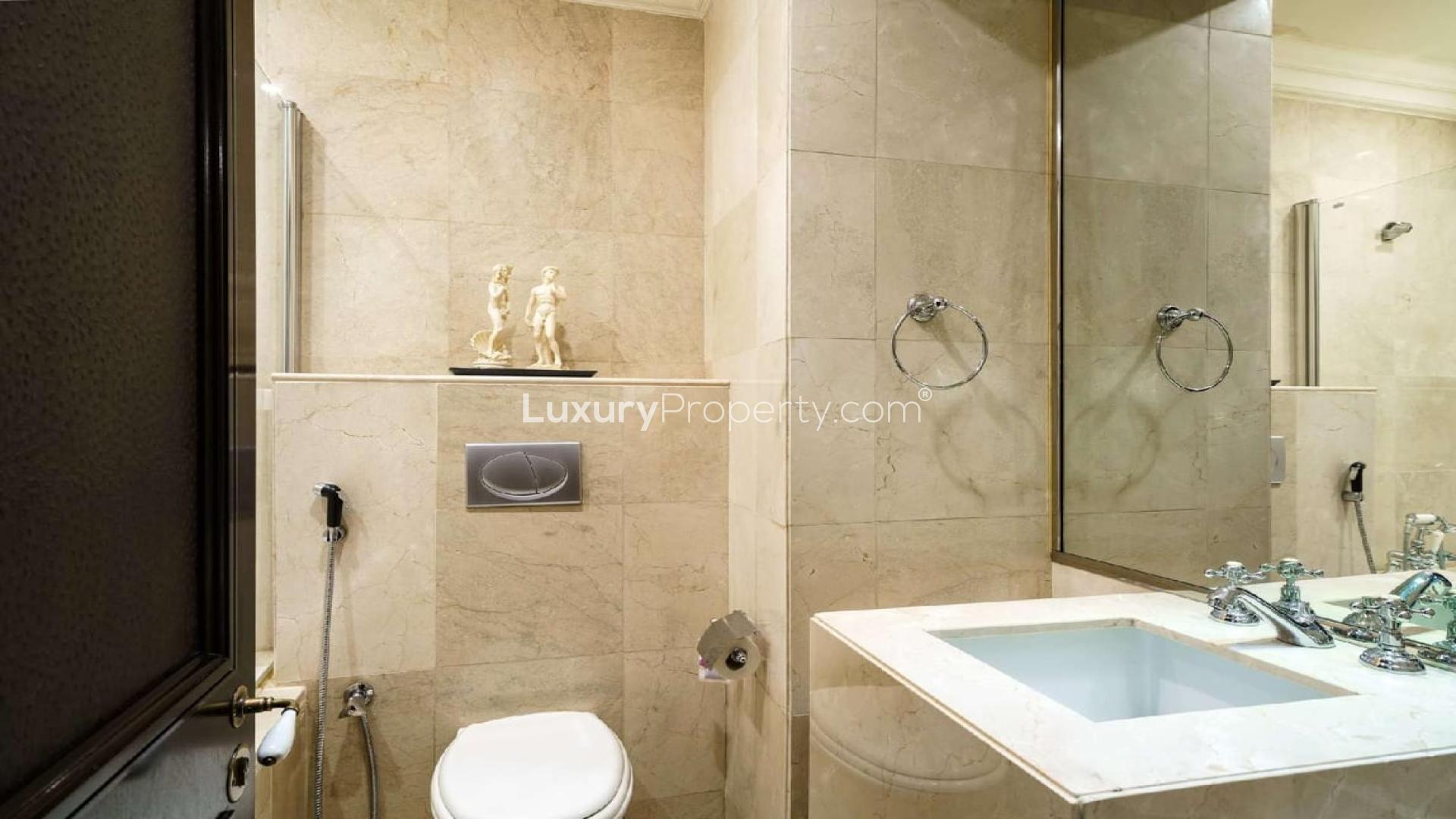 Luxurious living room in Old Town apartment with elegant chandeliers and stylish furnishings