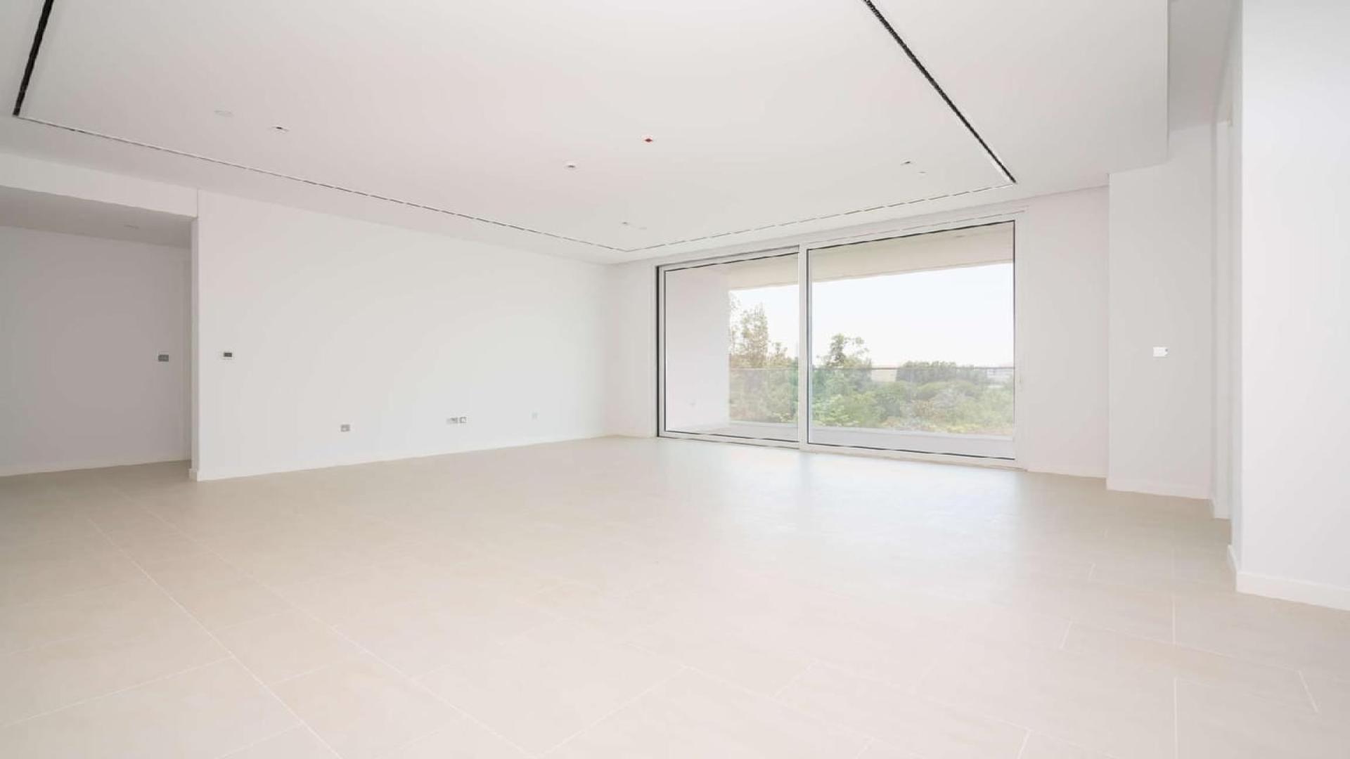 Spacious living area with large windows in Seventh Heaven, Al Barari apartment for sale