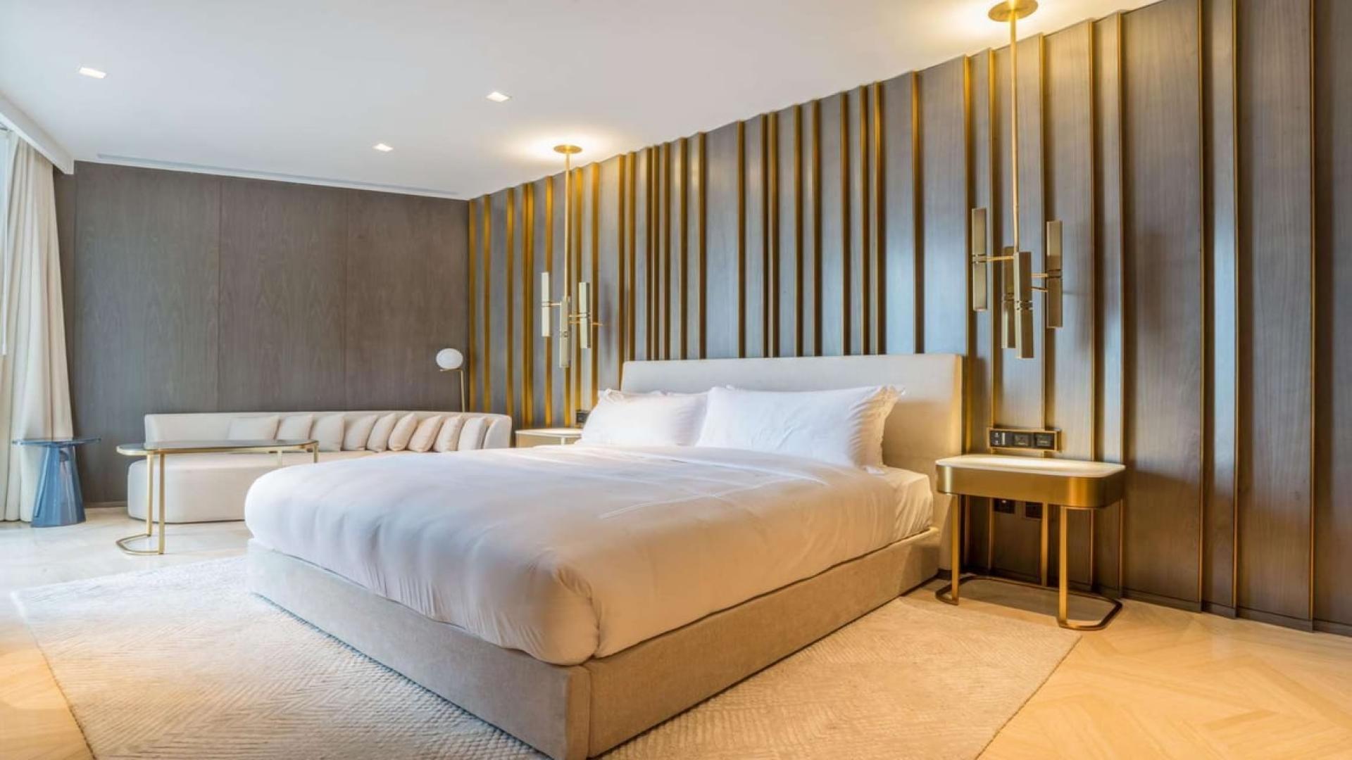 Luxury furnished bedroom with stunning skyline and sea view at FIVE Palm Jumeirah apartment