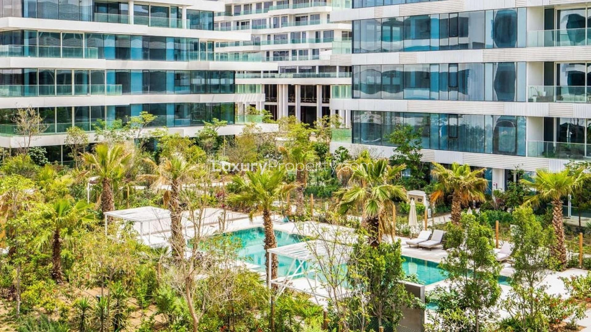 Ashjar at Al Barari apartments with lush gardens and pool in stunning residential setting