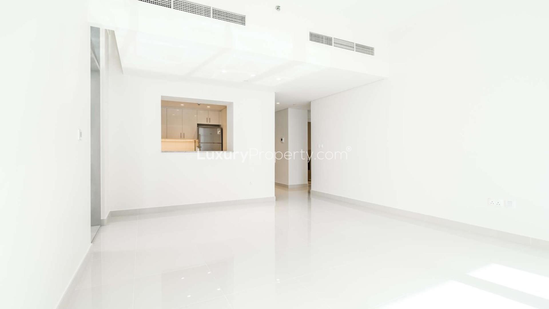 Modern BLVD Crescent Tower 1 exterior with palm trees, Downtown Dubai apartment for sale