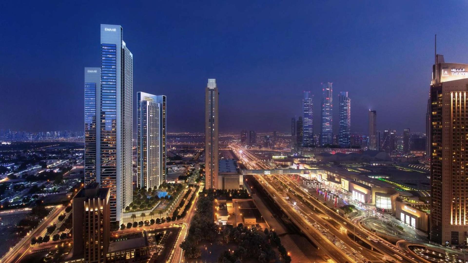 Luxury apartment balcony with stunning downtown Dubai skyline views at sunset