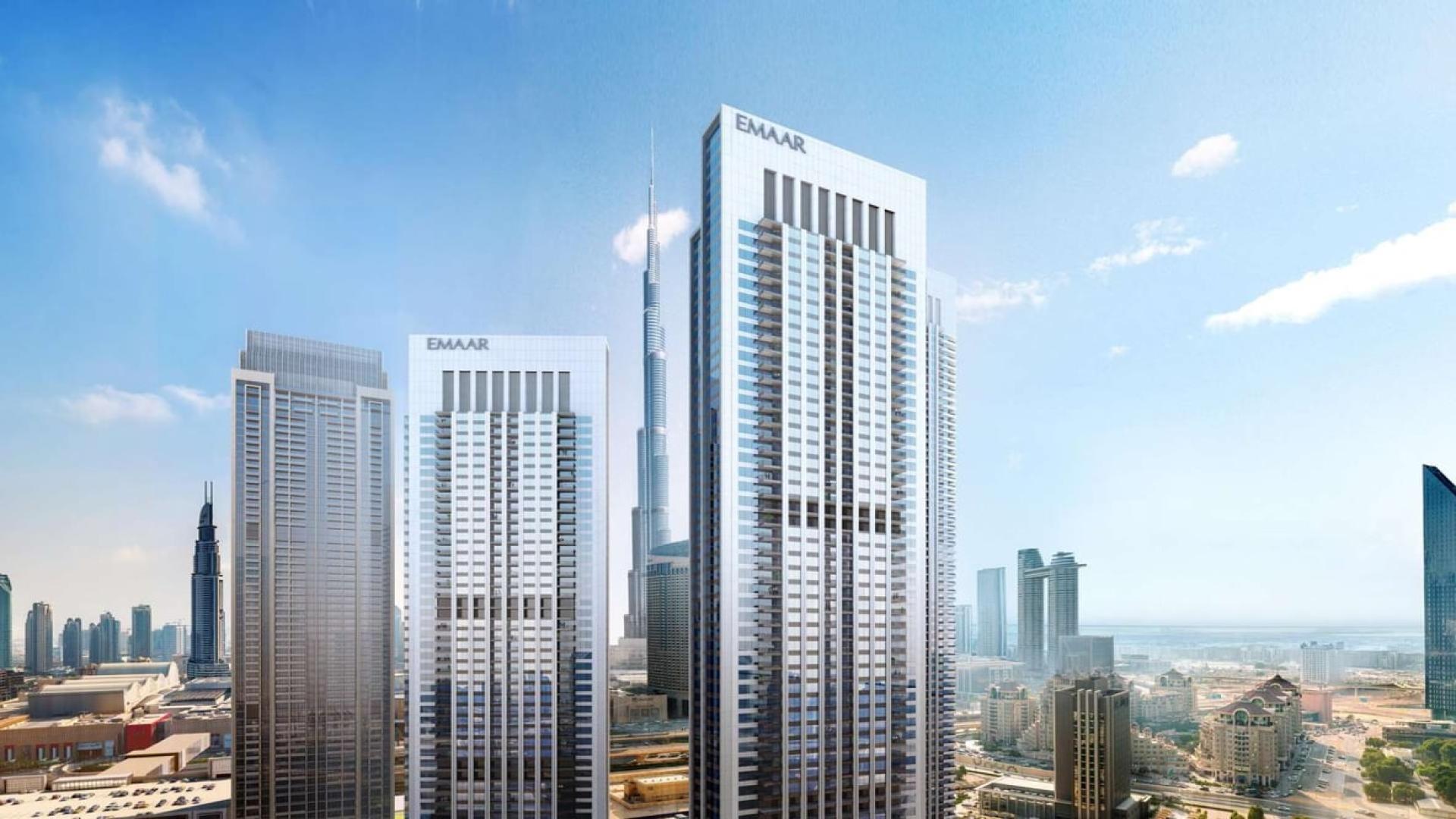 Luxurious Downtown Dubai apartment bedroom with stunning city skyline view through large window