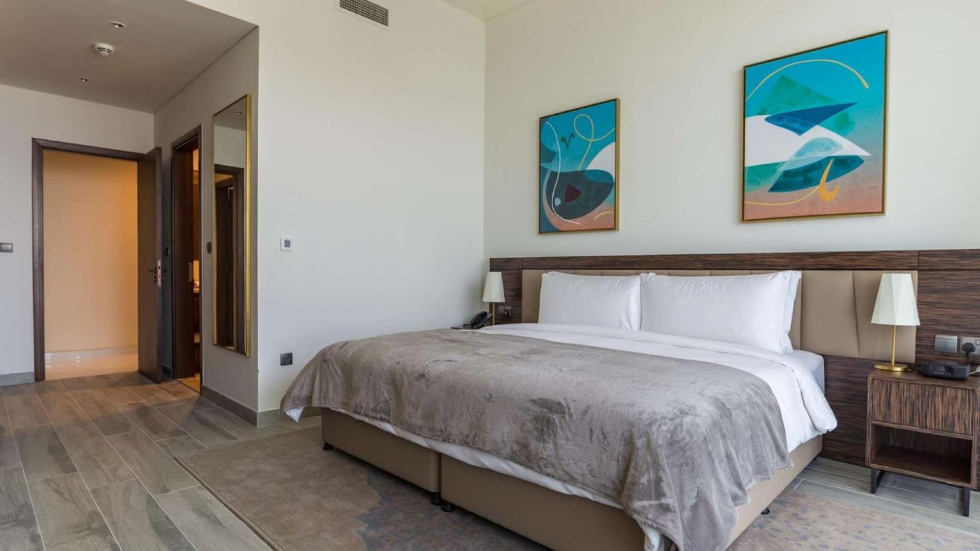 Furnished Dubai apartment with stunning views, modern decor, and spacious living area in Media City